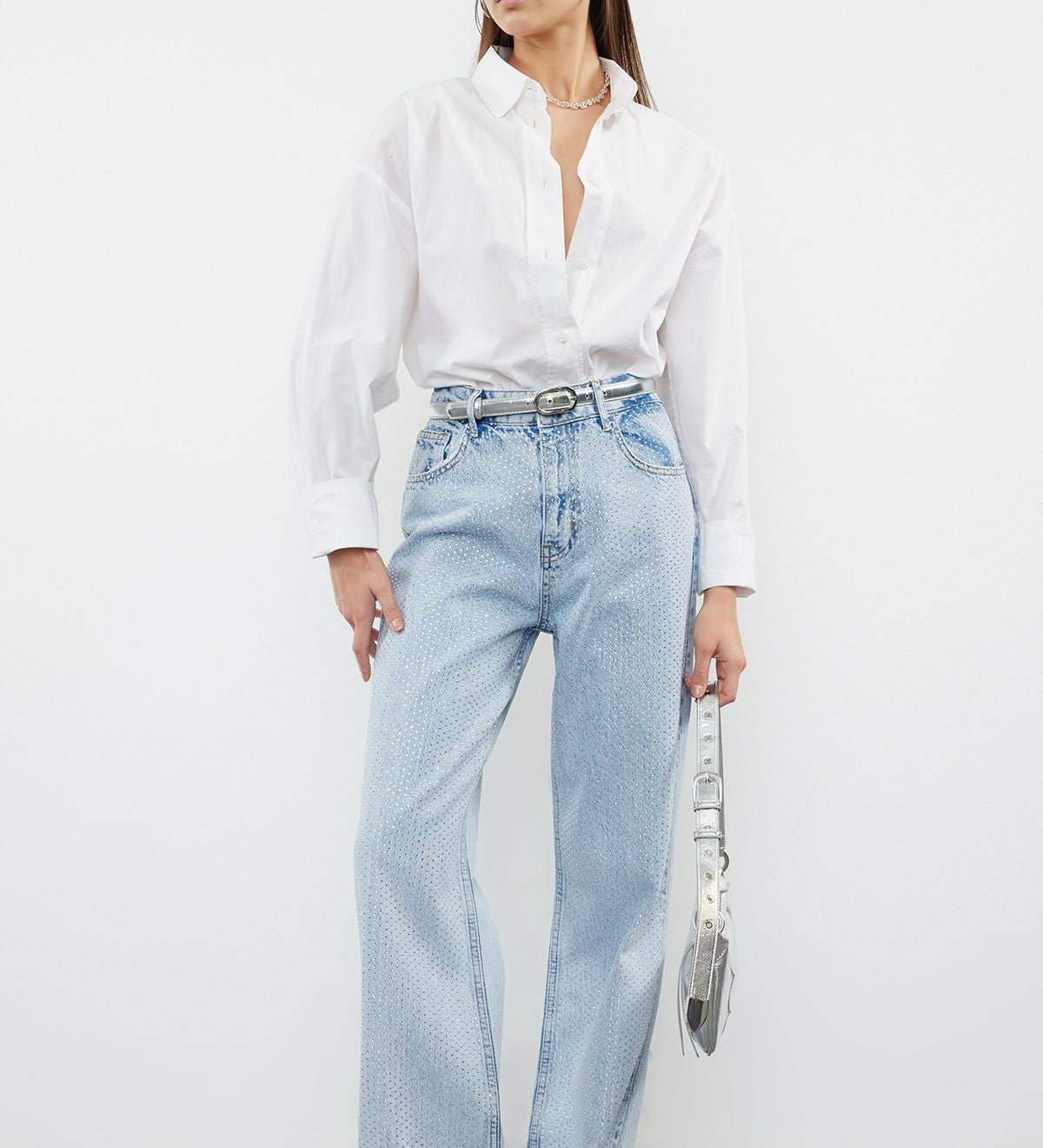 Shine bright with these high-waisted light wash jeans featuring all-over rhinestone embellishments. These stylish flare jeans combine comfort and glam, perfect for any casual or party look. Shop now for sparkling denim that turns heads!”
