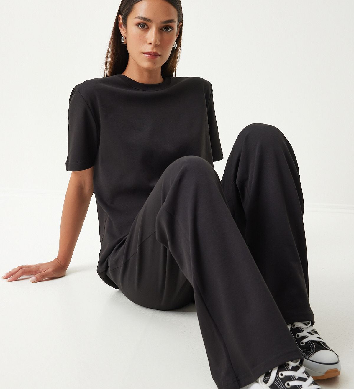  Embrace comfort and style with our Classic Black Loungewear Set. Featuring a relaxed-fit T-shirt and wide-leg pants, this sleek and versatile set is perfect for lounging or casual outings. Shop now for stylish and comfortable loungewear!