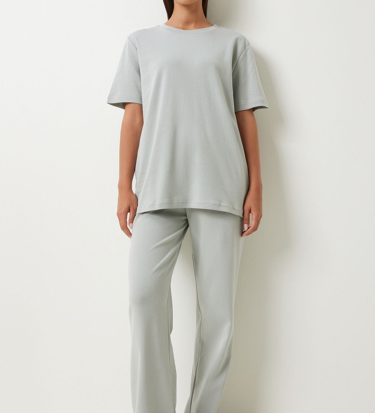  
Experience the ultimate in comfort and style with our Minimalist Gray Loungewear Set. Featuring a relaxed-fit T-shirt and wide-leg pants, this sleek and versatile set is perfect for lounging or casual outings. Shop now for stylish and comfortable loungewear!