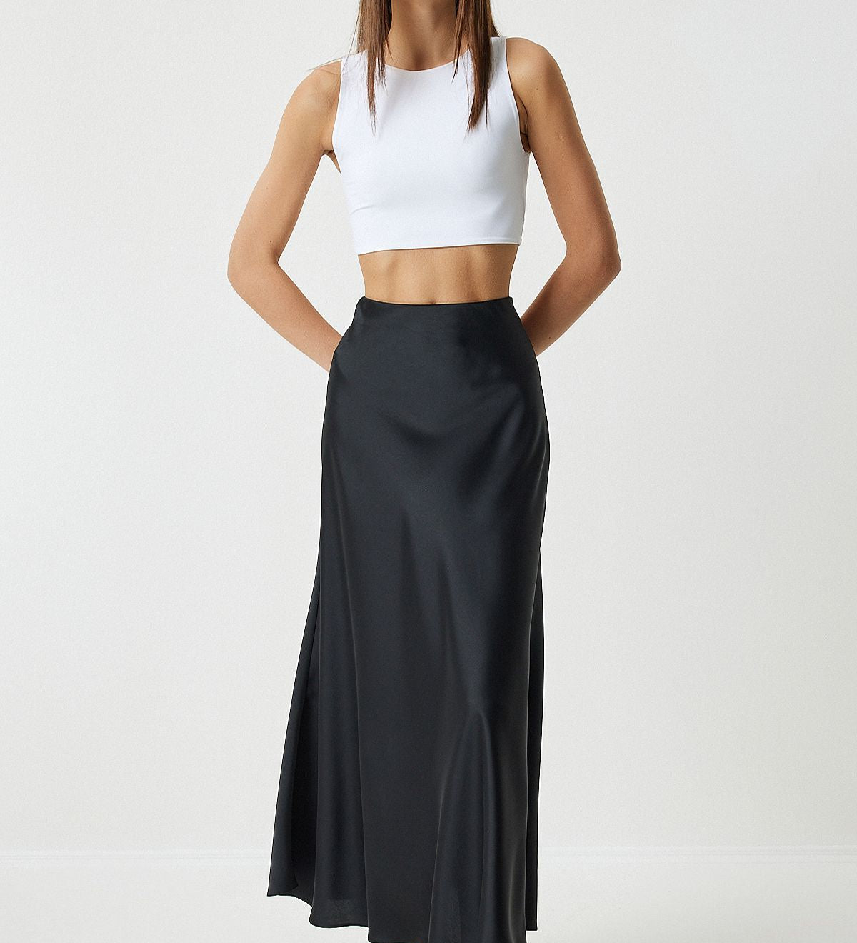 Shop our Elegant Black Satin Maxi Skirt, perfect for any occasion. This A-line silhouette skirt offers a luxurious satin finish and a comfortable fit, making it a versatile addition to your wardrobe. Ideal for both casual and formal events enjoy free shipping!
